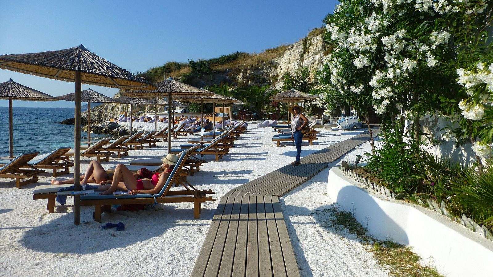 Relaxed beach bar on a sandy Greek shore